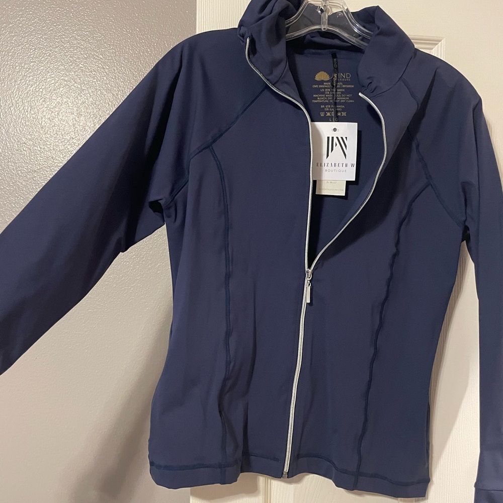 Brand new women’s zip up athleisure jacket.